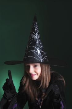 portrait of an eleven years old girl dressed as a witch