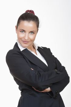 young beautiful businesswoman with her arms crossed looking at camera