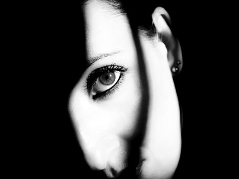 Eye looking to infinity shadows around.
Horizontal rectangular artistic black and white digital photo.