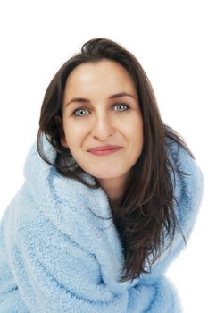 attractive brunette in blue bathrobe with hood isolated on white