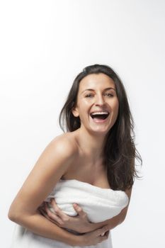 brunette with long hair in white towel isolated on white background