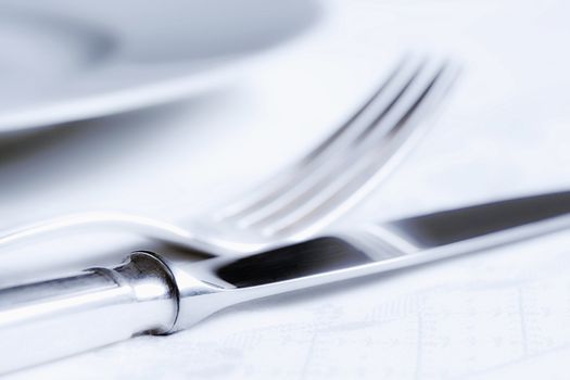 elegant table setting with silverware and white plate