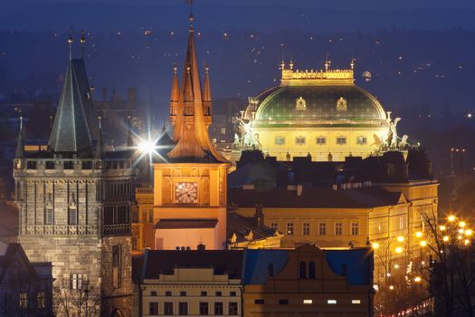 czech republic, prague - towers of the old town and national theatre at dusk