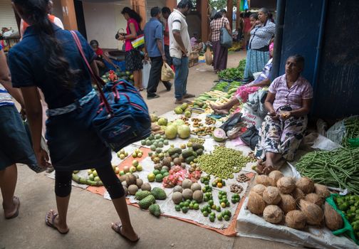 TANGALLE, SOUTHERN PROVINCE, SRI LANKA - DECEMBER 17, 2014: Vegetable vendor in the market on December 17, 2014 in Tangalle, Southern Province, Sri Lanka, Asia.