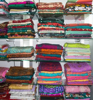 TANGALLE, SOUTHERN PROVINCE, SRI LANKA - DECEMBER 17, 2014: Colorful fabrics on display in a store on December 17, 2014 in Tangalle, Southern Province, Sri Lanka, Asia.