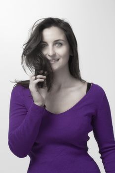 woman with long dark hair in mauve top isolated on white background