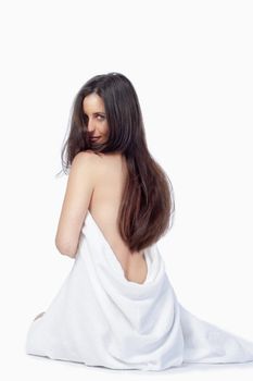 brunette with long hair in white towel isolated on white background