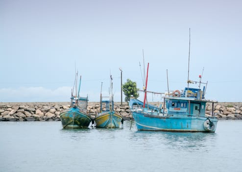 TANGALLE, SOUTHERN PROVINCE, SRI LANKA, ASIA - DECEMBER 20, 2014: Colorful wood fishing boats moored on December 20, 2014 in Tangalle port, Southern Province, Sri Lanka.