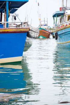 TANGALLE, SOUTHERN PROVINCE, SRI LANKA, ASIA - DECEMBER 20, 2014: Colorful wood fishing boats moored on December 20, 2014 in Tangalle port, Southern Province, Sri Lanka.