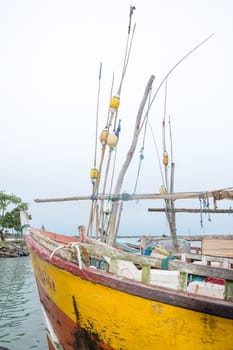 TANGALLE, SOUTHERN PROVINCE, SRI LANKA, ASIA - DECEMBER 20, 2014: Colorful wood fishing boats moored on December 20, 2014 in Tangalle port, Southern Province, Sri Lanka.