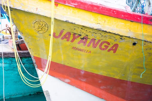 TANGALLE, SOUTHERN PROVINCE, SRI LANKA, ASIA - DECEMBER 20, 2014: Colorful wood fishing boats moored on December 20, 2014 in Tangalle port, Southern Province, Sri Lanka.