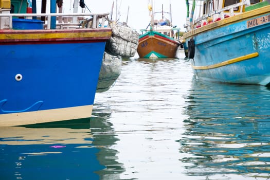 TANGALLE, SOUTHERN PROVINCE, SRI LANKA, ASIA - DECEMBER 20, 2014: Colorful wood fishing boats moored on December 20, 2014 in Tangalle port, Southern Province, Sri Lanka.