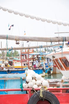 TANGALLE, SOUTHERN PROVINCE, SRI LANKA, ASIA - DECEMBER 20, 2014: Colorful wood fishing boats moored on December 20, 2014 in Tangalle port, Southern Province, Sri Lanka.