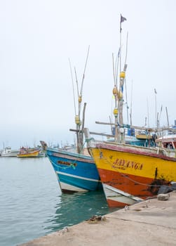 TANGALLE, SOUTHERN PROVINCE, SRI LANKA, ASIA - DECEMBER 20, 2014: Colorful wood fishing boats moored on December 20, 2014 in Tangalle port, Southern Province, Sri Lanka.