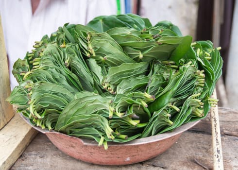 Betel leaves. The chew of betel (dahat-vita) is mostly for consumption after meals, and consists of betel leaves, arecanut, and certain other items like cloves, nutmeg, cardamons, etc. which give a pleasant smell and a pungent taste when chewed. Dickwella, Southern Province, Sri Lanka, Asia.