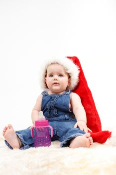 Child girl with Christmas santa hat on white background