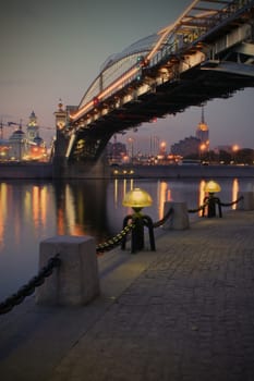 Moscow, Russia, evening, torch on quay of the Moscow-river under Bogdan Hmelnizky bridge near Kiev station, instagram image style