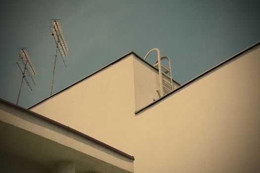 elements of the design of the modern architecture roof of the building with metallic antenna, instagram image style