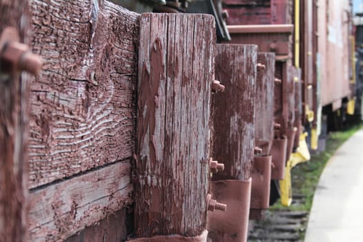 Old abandoned red train track post and rails