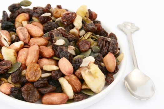 Bowl of mixed nuts on a white background