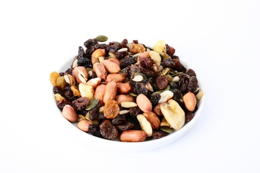 Bowl of mixed nuts on a white background