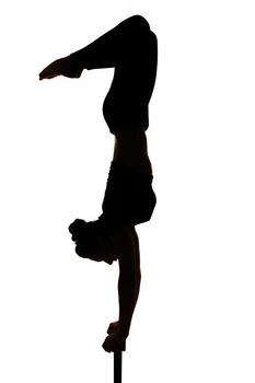 one caucasian woman contortionist practicing gymnastic yoga in silhouette on white background 