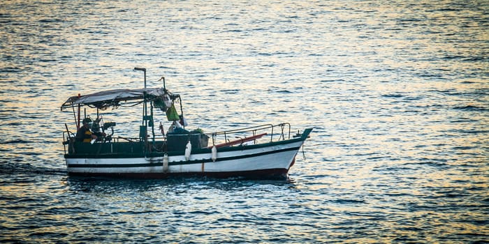 Fishermen on the boat on a Sunday morning