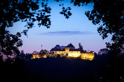 Brasov, Romania - July 24, 2013: Old fortress "Cetatuia" illuminated at night, Brasov, Romania