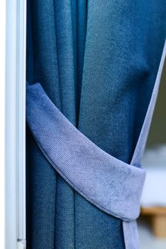 blue curtain with garter