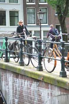 People riding their bike to work in Amsterdam, Netherlands.