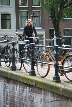 People riding their bike to work in Amsterdam, Netherlands.