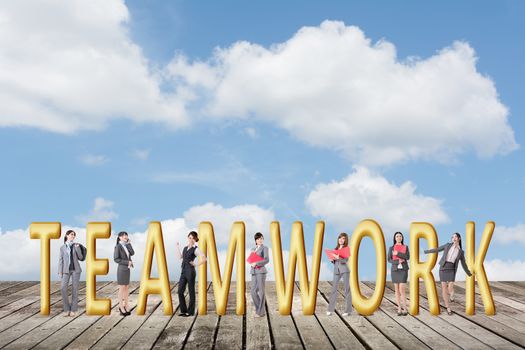 Concept of teamwork with group of business people stand with 3d text.