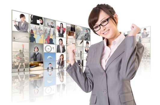 Cheerful Asian business woman standing in front of TV screen wall, closeup portrait.