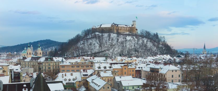 Panoramic view of Ljubljana, capital of Slovenia. Roofs covered in snow in winter time.