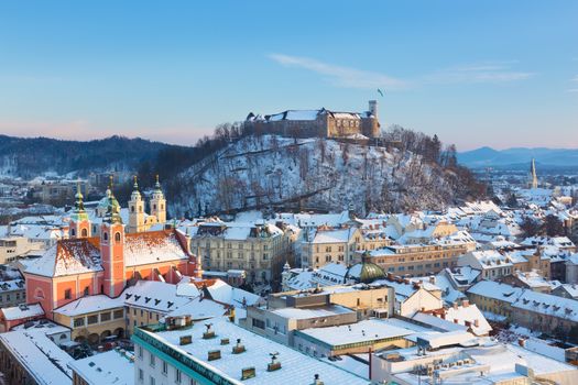 Panoramic view of Ljubljana, capital of Slovenia. Roofs covered in snow in winter time.