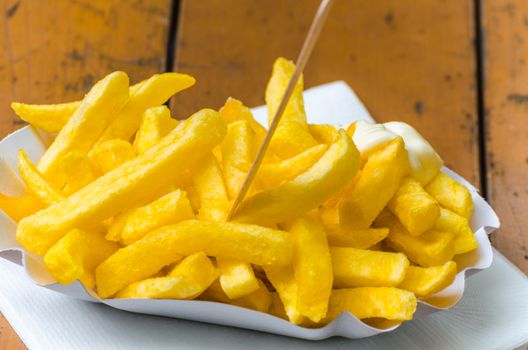 Close-up of typical fast-food meal on a wooden table.