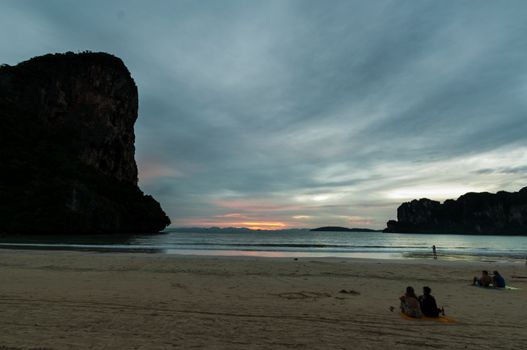 people at sunset on Railay beach in Krabi Thailand pefect vacation