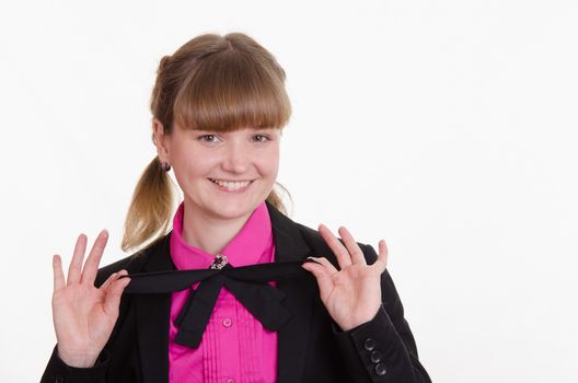 Portrait of a young girl in a suit