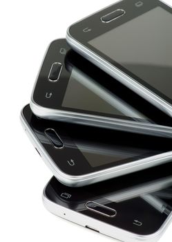 Arrangement of Four Black Smartphones with Silver Details and Buttons isolated on white background