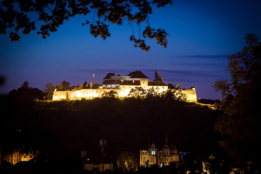 Brasov, Romania - July 24, 2013: Old fortress "Cetatuia" illuminated at night, Brasov, Romania