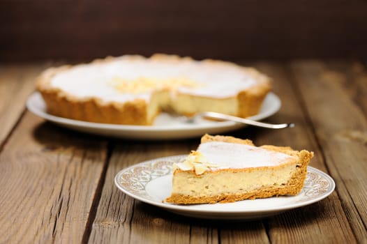 Banana tart piece on wooden background horizontal