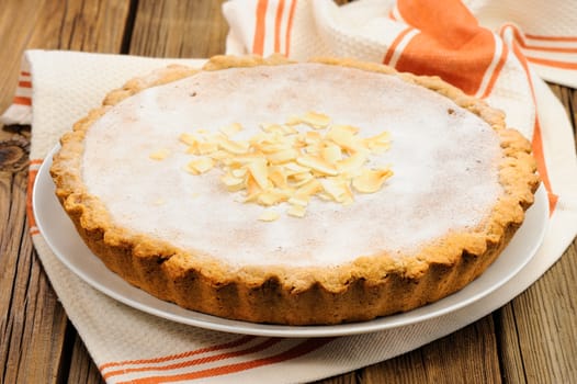 Round banana tart cacke on wooden background