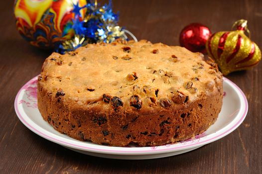 Round christmas cake and christmas toys horizontal