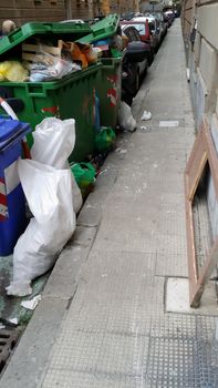 bins lined up along a city street