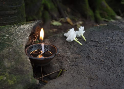 Flowers and oil burning. Ceremonial flowers and oil burning arrangement, Sri Lanka, Asia.
