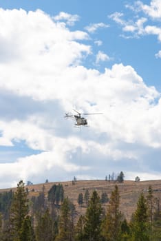Smoke-jumpers fight fire from helicopter in Yellowstone National Park, Wyoming USA