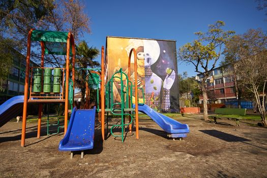 Colourful murals adorning the walls of tenement blocks in the San Miguel area of Santiago, capital of Chile. The area was created as an open air museum in what was a run down area of the city.