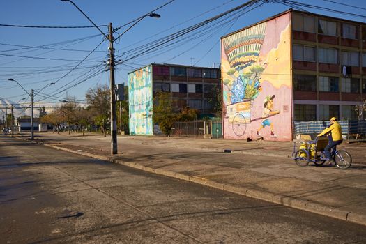 Colourful murals adorning the walls of tenement blocks in the San Miguel area of Santiago, capital of Chile. The area was created as an open air museum in what was a run down area of the city.