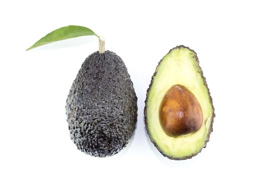 Avocados with leaves on a white background