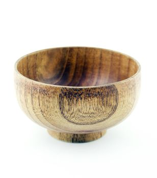 Empty wooden bowl on a white background.